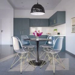 LeisureMod Cresco Plastic Dining Chair With Eiffel Gold Legs Set Of 4 - Transparent Orange -Gourmet Interiors eb5de76f 4210 4272 9010 9dd35d589066